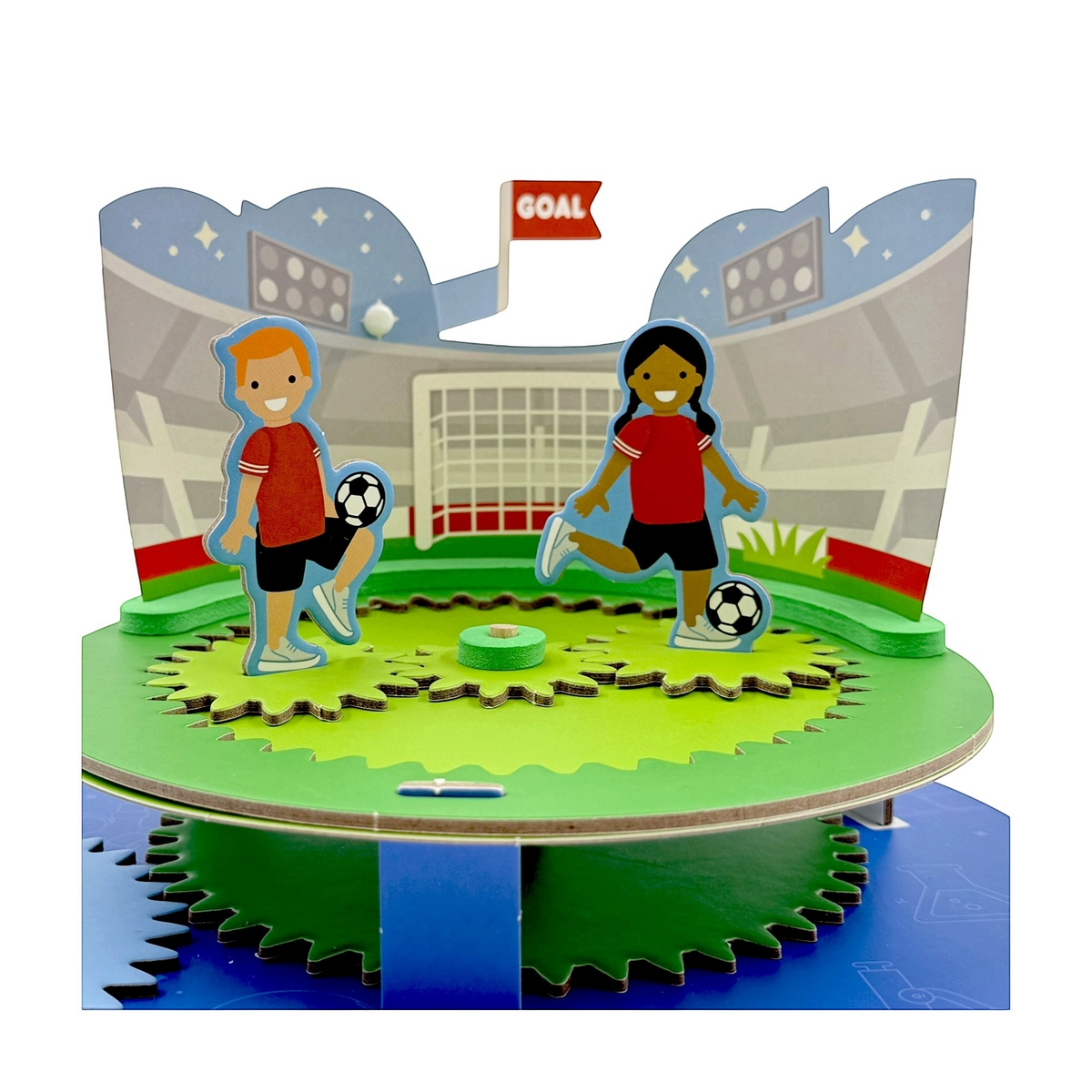 Gear Imagineer kit components laid out — coloured gears, dowels, character sheets and stadium background pieces