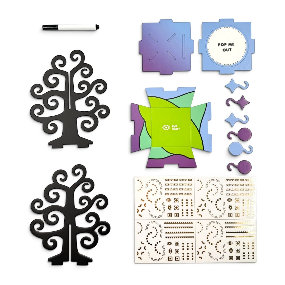 Eye Heart Golden Gratitude Tree sculpture kit with black tree pieces, gold stickers, marker, and colorful box parts.